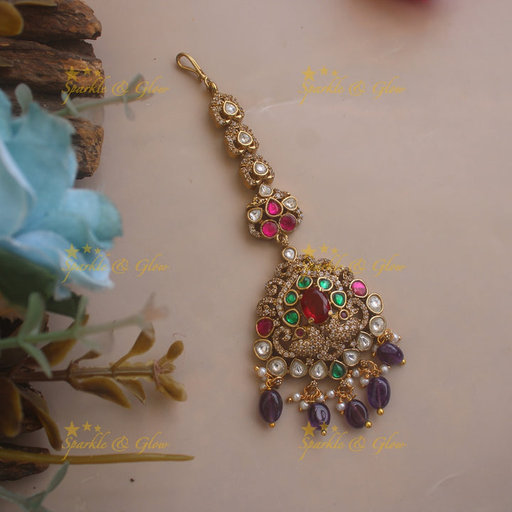 Stunning Peacock design Victorian AD maang tikka with multi colour stones and purple beads