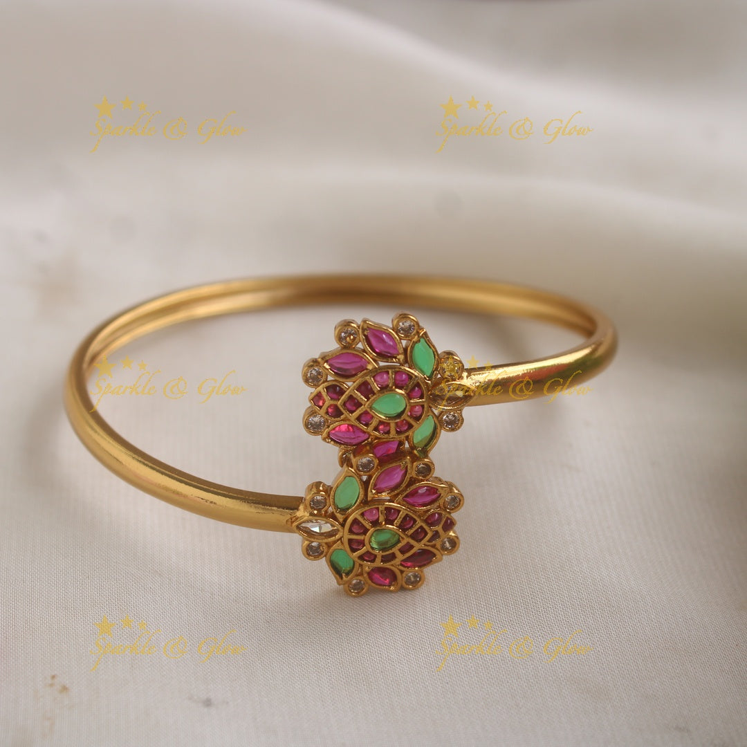 Statement Lotus design bracelet with ruby and emerald stones