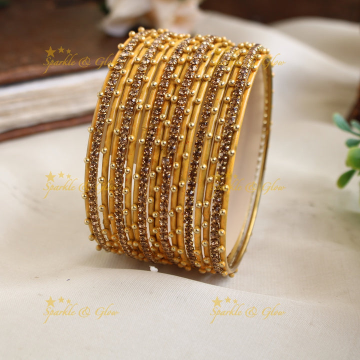 Beautiful Bubble design Metal Bangle Combo Box in Assorted colours with gold stone bangles