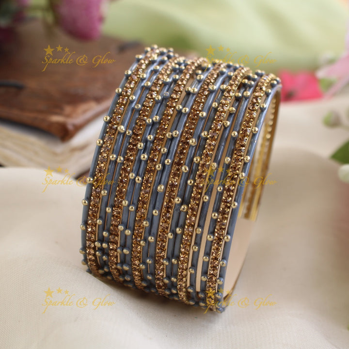 Beautiful Bubble design Metal Bangle Combo Box in Assorted colours with gold stone bangles