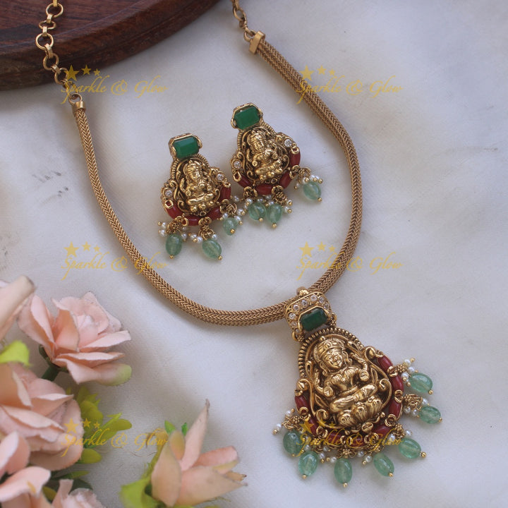 Statement Lakshmi carved pendant Chain with coral emerald and mint green beads