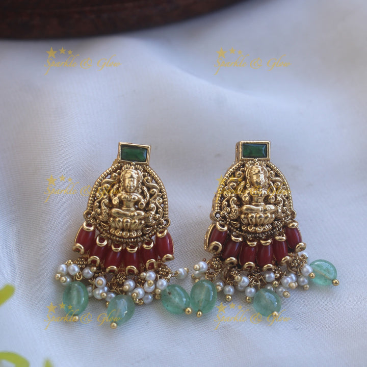 Beautiful Lakshmi peacock carved pendant Chain with coral emerald and mint green beads