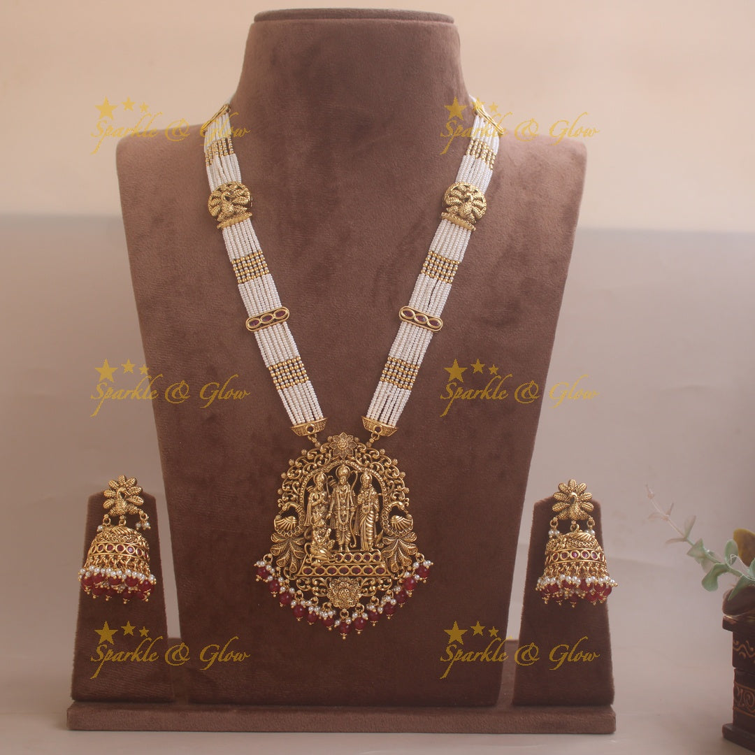 Gorgeous Rama Parivar carved pendant haram with ruby and multi layer pearl chain and red beads