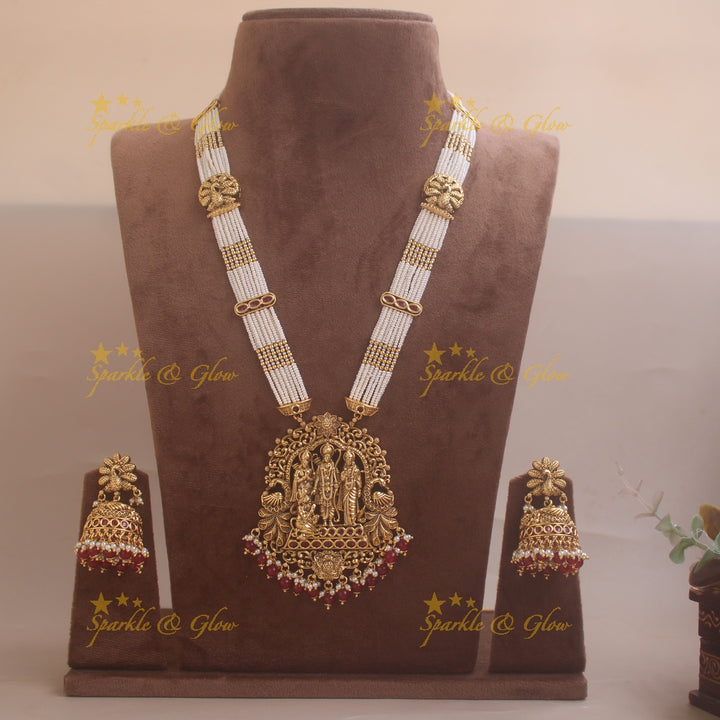 Gorgeous Rama Parivar carved pendant haram with ruby and multi layer pearl chain and red beads