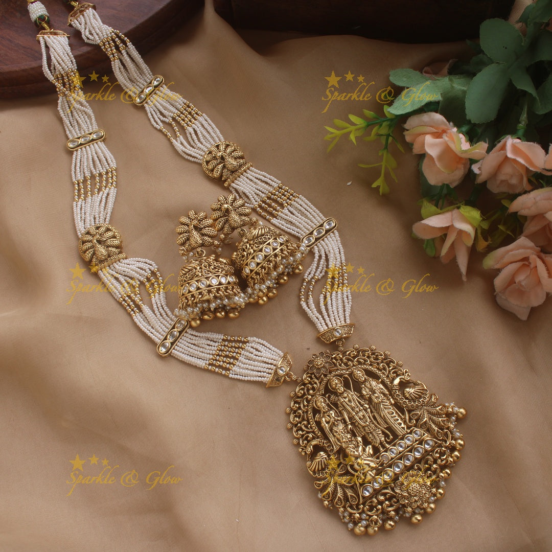 Gorgeous Rama Parivar carved pendant haram with ruby and multi layer pearl chain and red beads