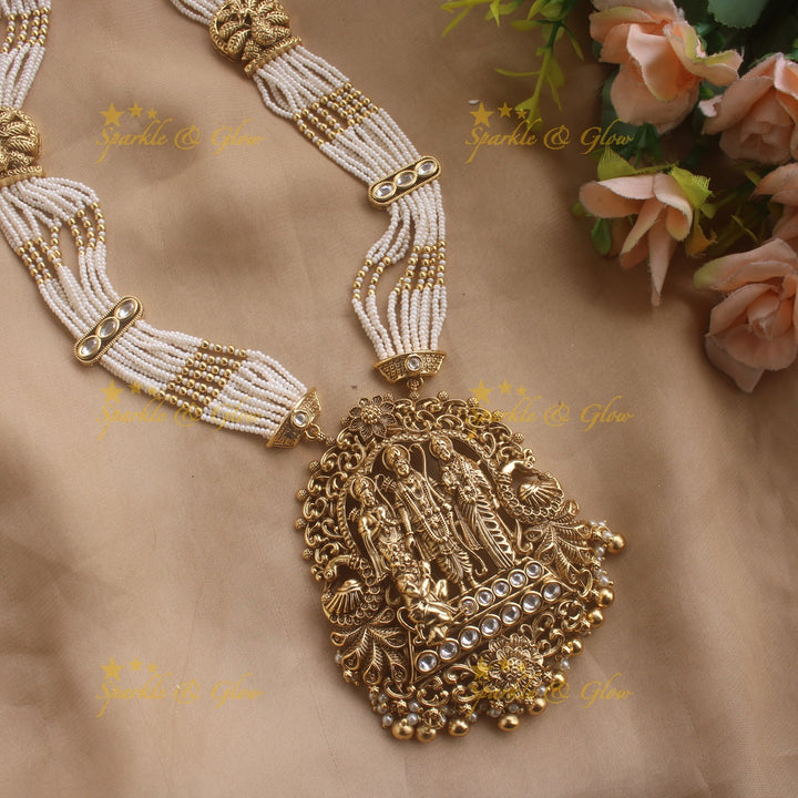 Gorgeous Ram Parivar carved pendant haram with ruby and multi layer pearl chain and gold beads