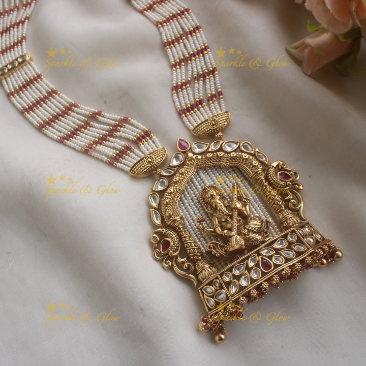 Exclusive Ganesha carved pendant haram with kundan stones and multi layer pearl and pink beads chain