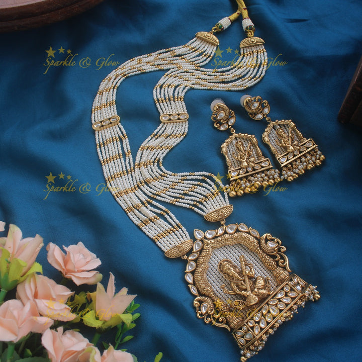 Exclusive Ganesha carved pendant haram with kundan stones and multi layer pearl and gold beads chain