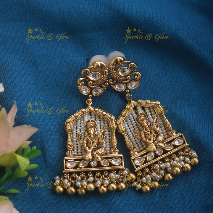 Exclusive Ganesha carved pendant haram with kundan stones and multi layer pearl and gold beads chain