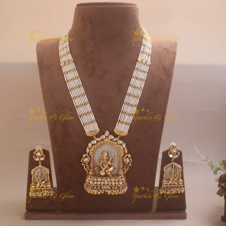 Exclusive Ganesha carved pendant haram with kundan stones and multi layer pearl and gold beads chain
