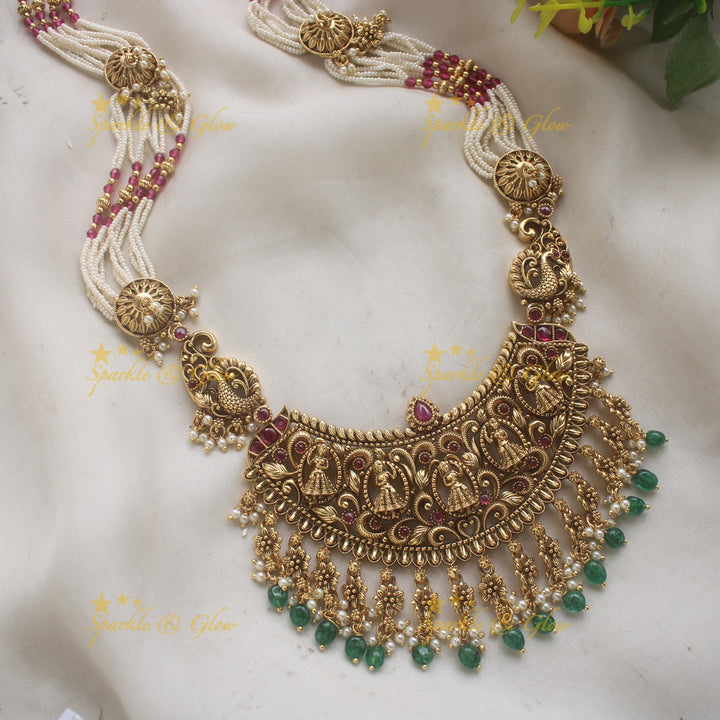 Gorgeous Bridal Procession carved pendant haram with multi layered Rubypearl chain with green beads