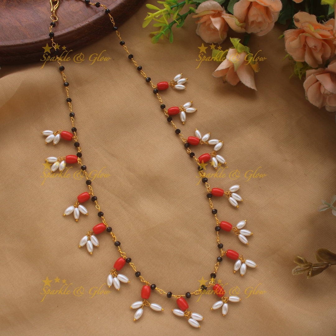 Elegant Black beaded Necklace with Rice pearls and Corals