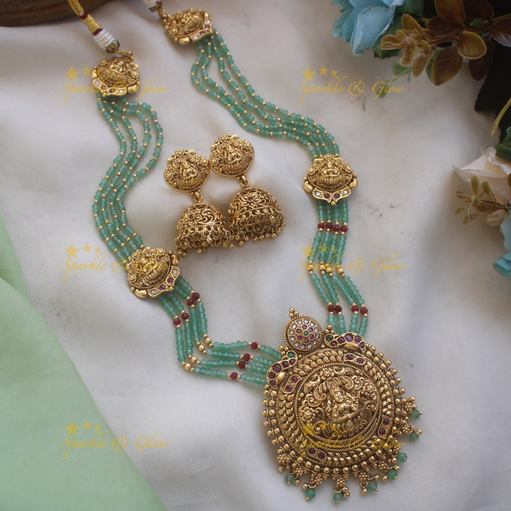 Elegant Dual Tone peacock carved Idol Lakshmi Elephant Haram with multi layered Rubygreen beads chain