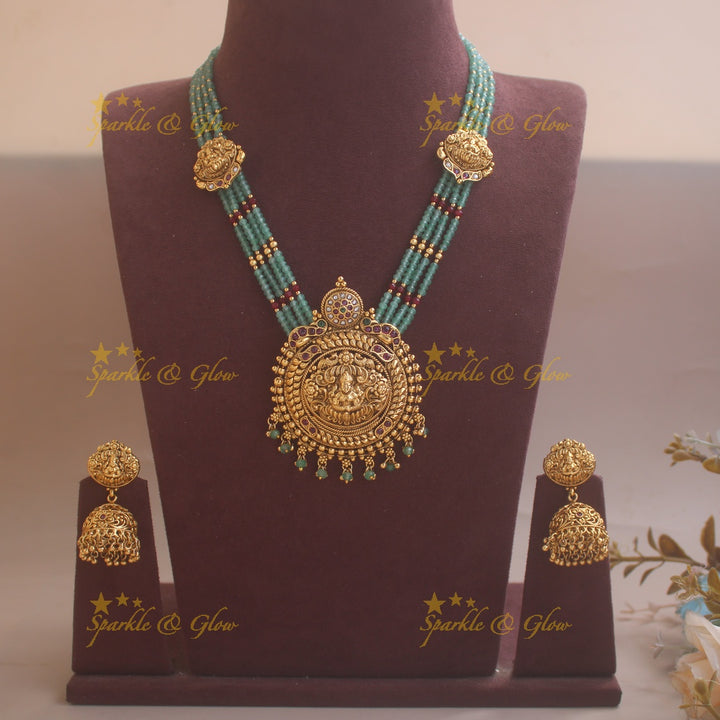 Elegant Dual Tone peacock carved Idol Lakshmi Elephant Haram with multi layered Rubygreen beads chain