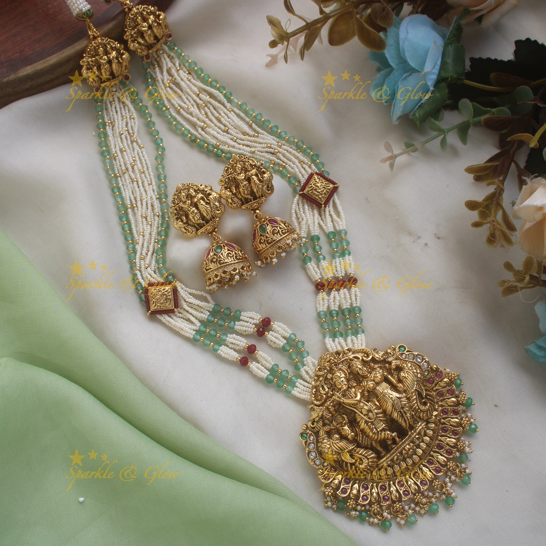 Grand Radhakrishna peacock carved pendant haram with multi layered pearl and rubygreen beads chain