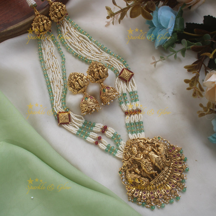 Grand Radhakrishna peacock carved pendant haram with multi layered pearl and rubygreen beads chain