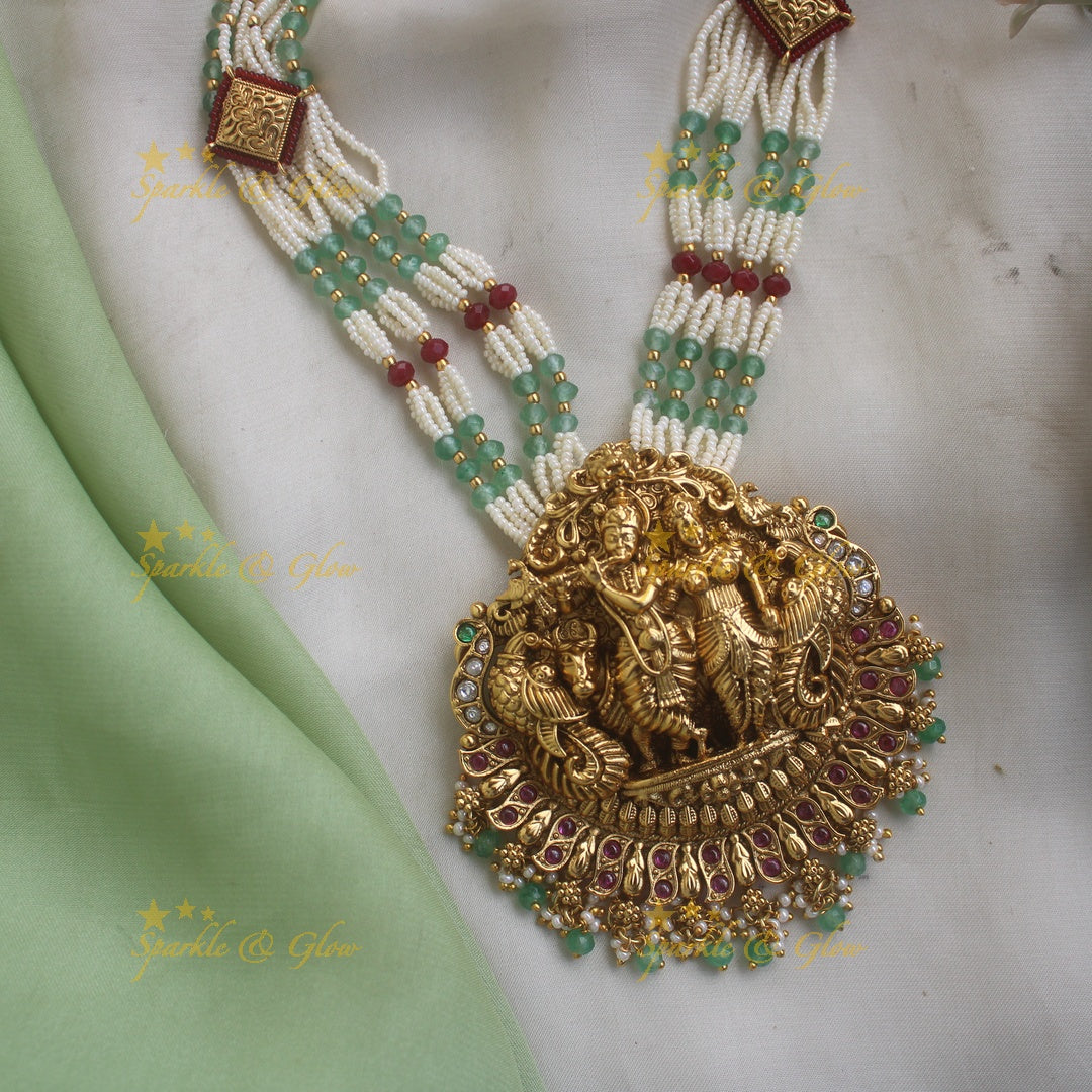 Grand Radhakrishna peacock carved pendant haram with multi layered pearl and rubygreen beads chain