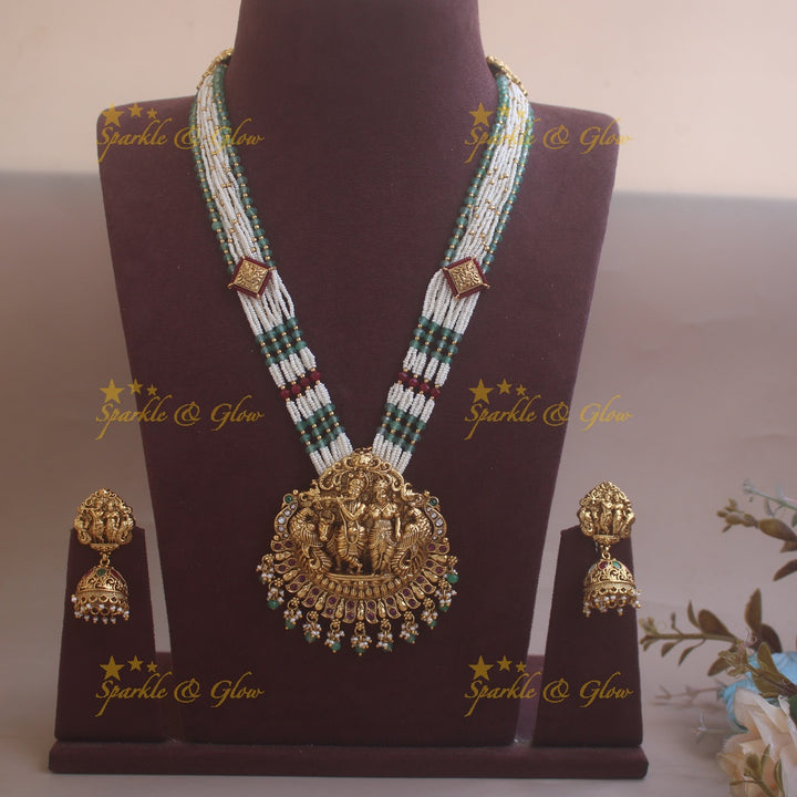 Grand Radhakrishna peacock carved pendant haram with multi layered pearl and rubygreen beads chain