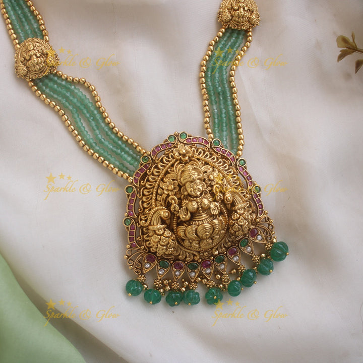 Stunning Lakshmi Peacock carved pendant haram with multi layered Mintgreen and Gold beads chain