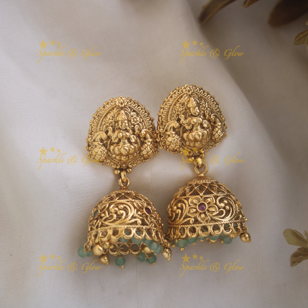 Stunning Lakshmi Peacock carved pendant haram with multi layered Mintgreen and Gold beads chain