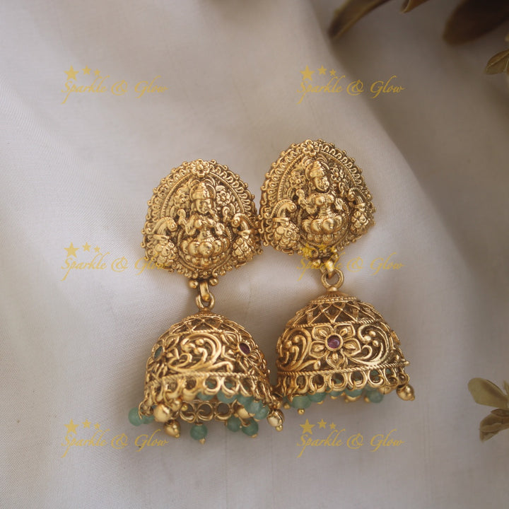 Stunning Lakshmi Peacock carved pendant haram with multi layered Mintgreen and Gold beads chain
