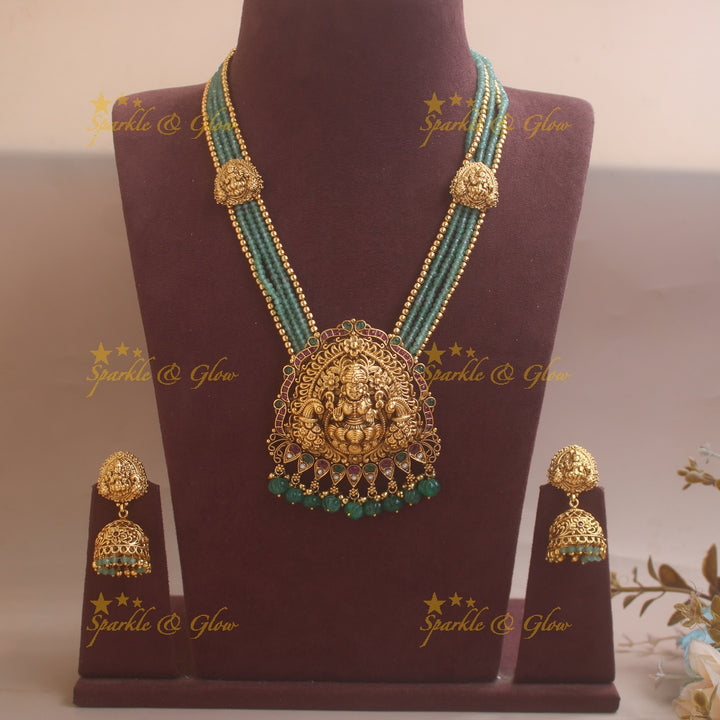 Stunning Lakshmi Peacock carved pendant haram with multi layered Mintgreen and Gold beads chain