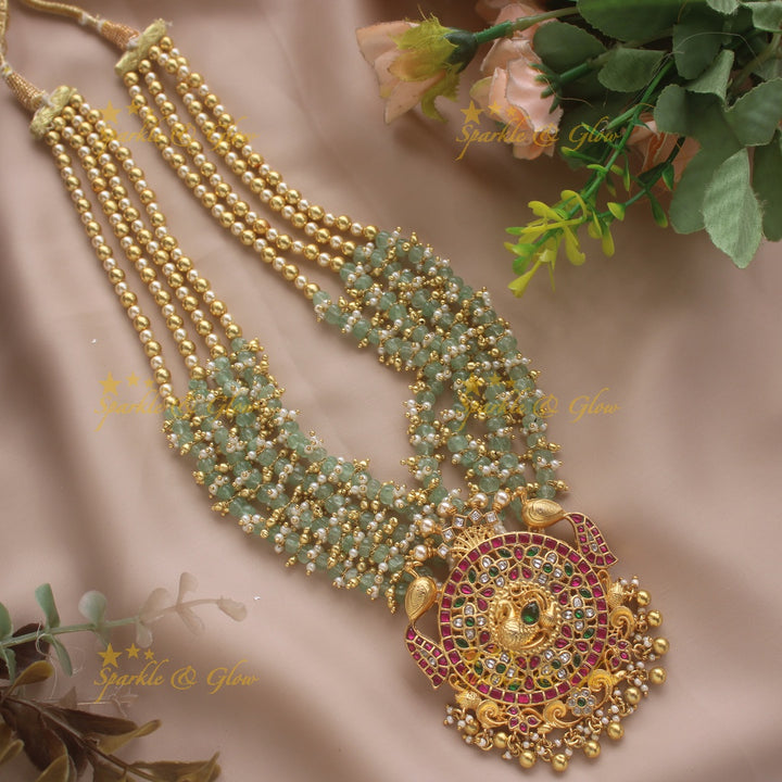 Grand Floral peacock design jadau pandent haram with multi layer pearl gold and mint green beads chain
