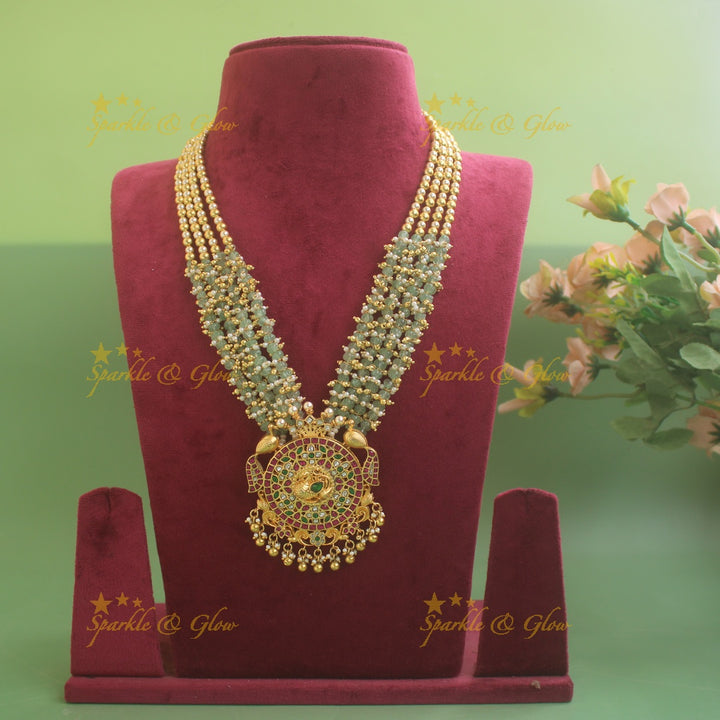 Grand Floral peacock design jadau pandent haram with multi layer pearl gold and mint green beads chain