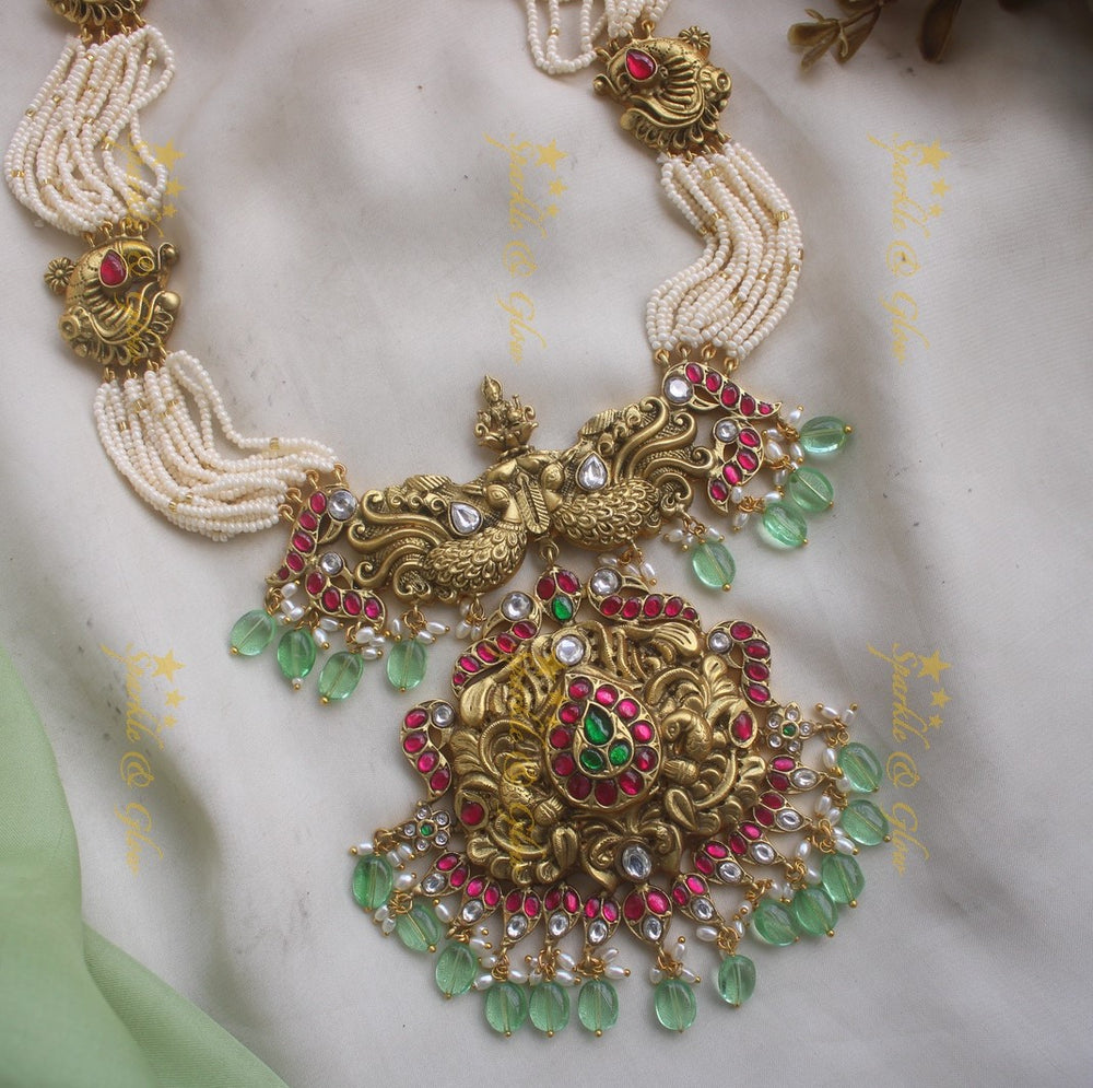 Grand Intricate Peacock carved jadau haram with multi layer pearl chain and mint green beads - Sparkle and Glow
