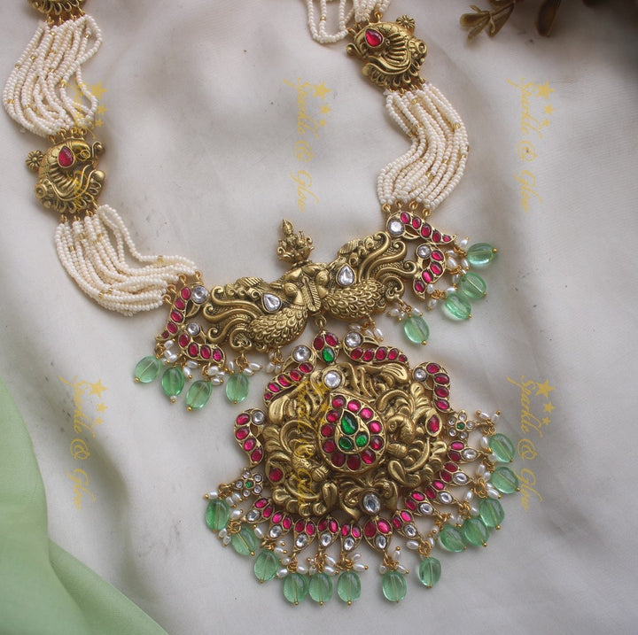 Grand Intricate Peacock carved jadau haram with multi layer pearl chain and mint green beads