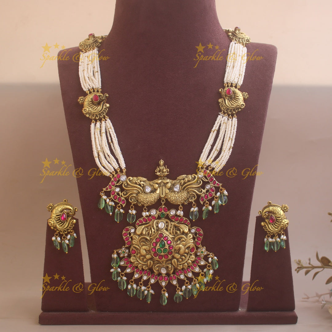 Grand Intricate Peacock carved jadau haram with multi layer pearl chain and mint green beads