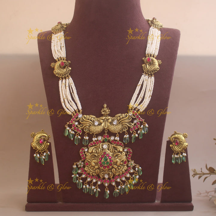 Grand Intricate Peacock carved jadau haram with multi layer pearl chain and mint green beads