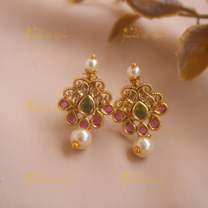 Gold alike Lakshmi coin and floral design AD short necklace with ruby emerald and pearls