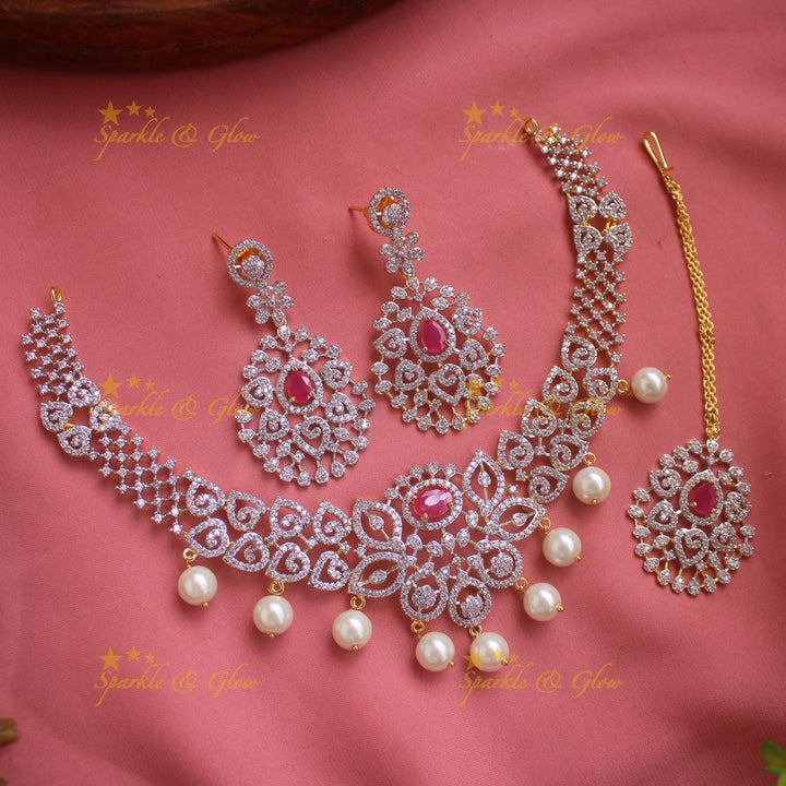Elegant Floral Leaflet design American diamond short necklace with emerald and pearl drops with maang tikka- pink