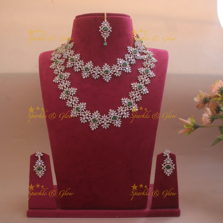 Exclusive Floral design American diamond necklace set  with emerald stones with maang tikka - green