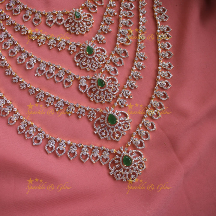 Sparkling Floral leaf design American diamond multi layer haram with emerald stones - green