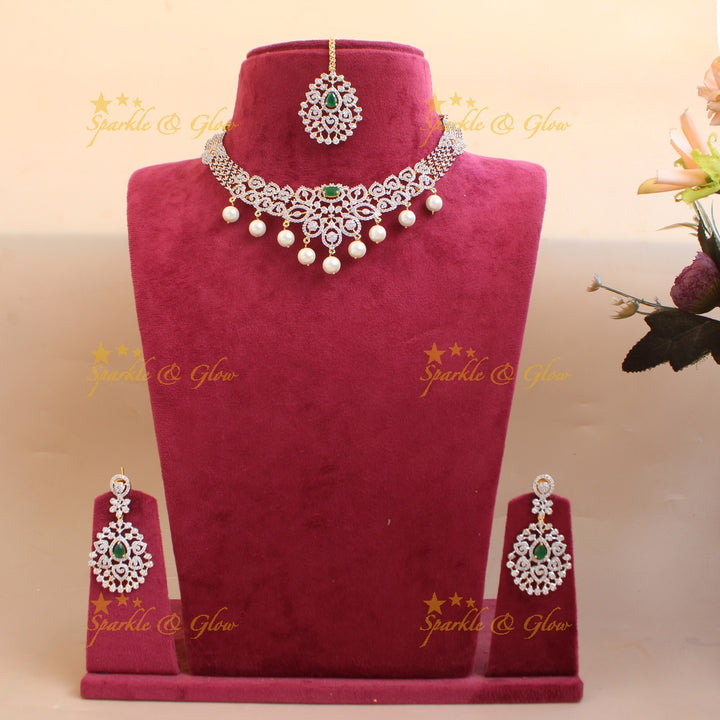 Elegant Floral Leaflet design American diamond short necklace with emerald and pearl drops with maang tikka- pink
