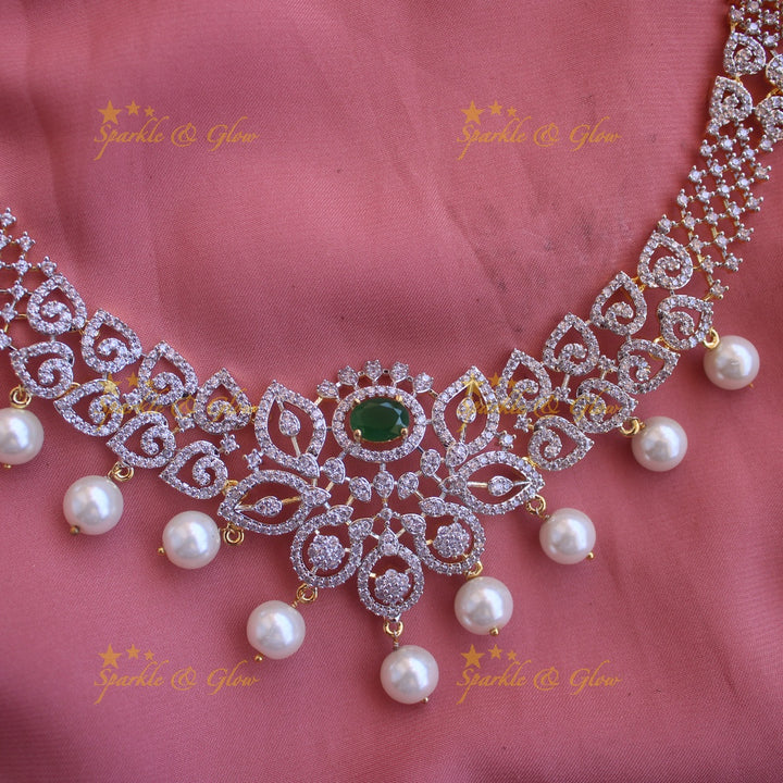 Elegant Floral Leaflet design American diamond short necklace with emerald and pearl drops with maang tikka- pink