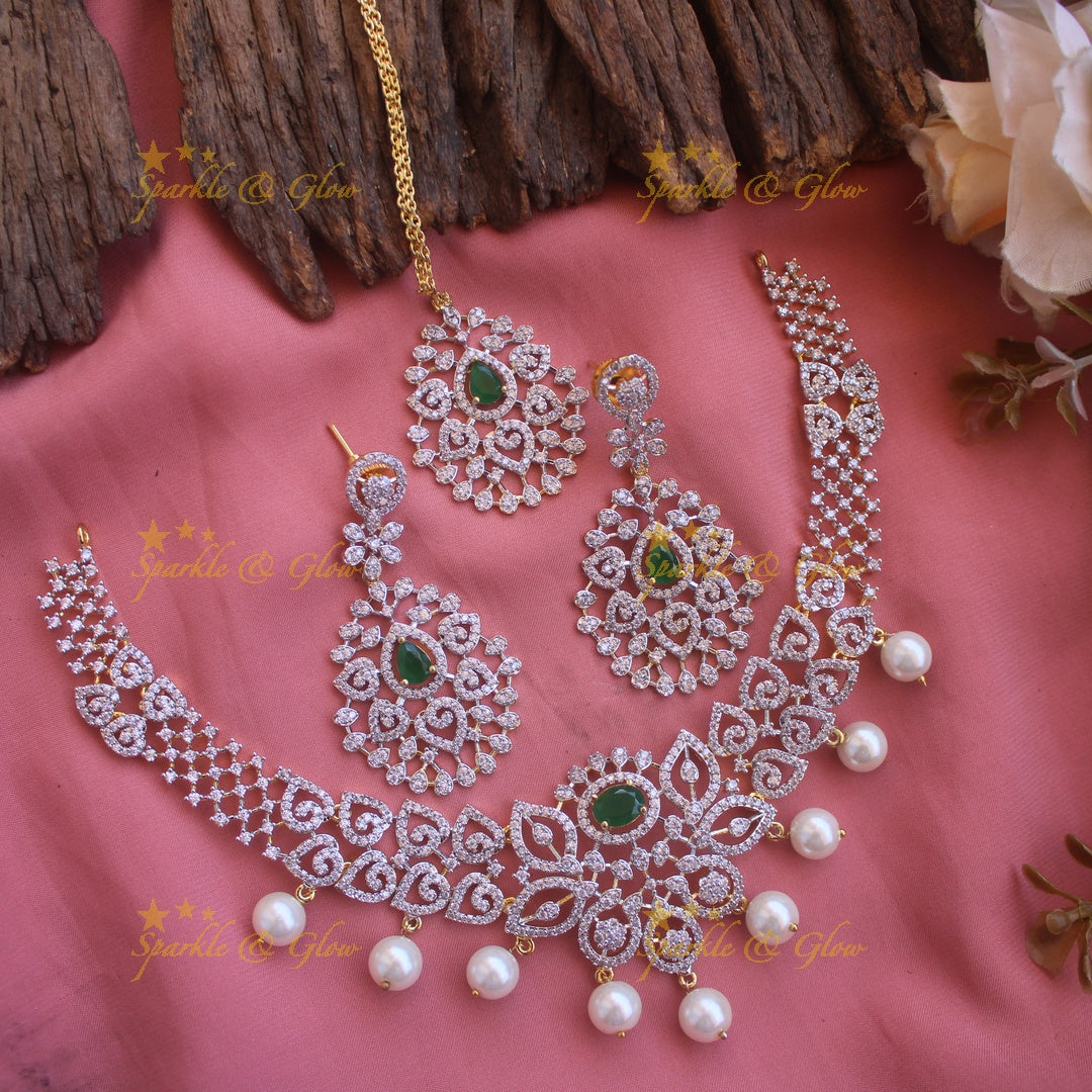 Elegant Floral Leaflet design American diamond short necklace with emerald and pearl drops with maang tikka- pink