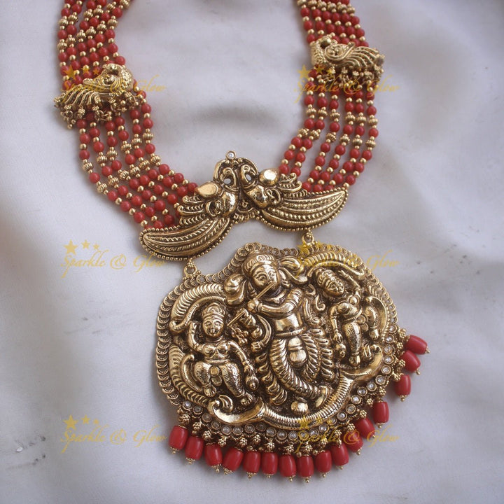 Gorgeous Krishna playing flute and peacock carved haram with multi layer gold and red beads chain - Sparkle and Glow - Back Thread - 