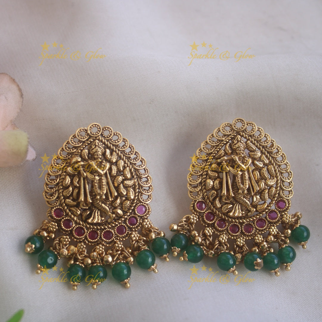 Gorgeous Krishna playing flute and peacock carved haram with multi layer gold and red beads chain
