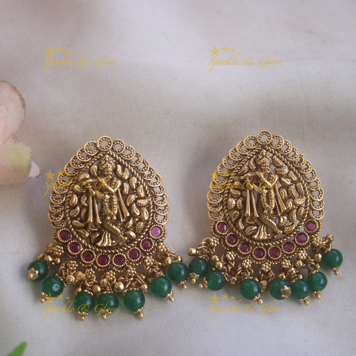 Gorgeous Krishna playing flute and peacock carved haram with multi layer gold and red beads chain