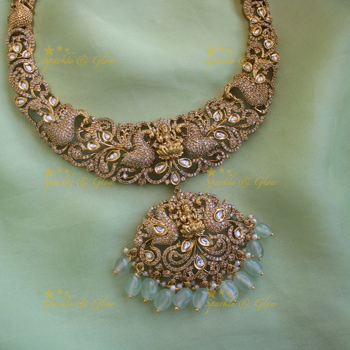 Grand intricate Lakshmi peacock carved victorian AD long necklace with mint green beads