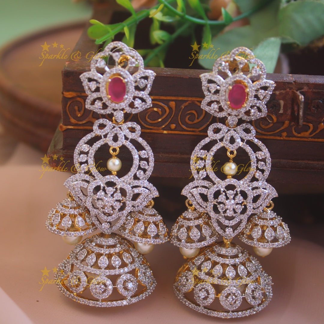 Stunning Floral and leaf design American diamond jumukas with ruby and pearl drops