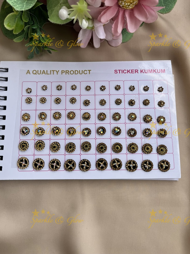 Navya round shape stone silver and gold design bindi with different size in spiral book in assorted colours