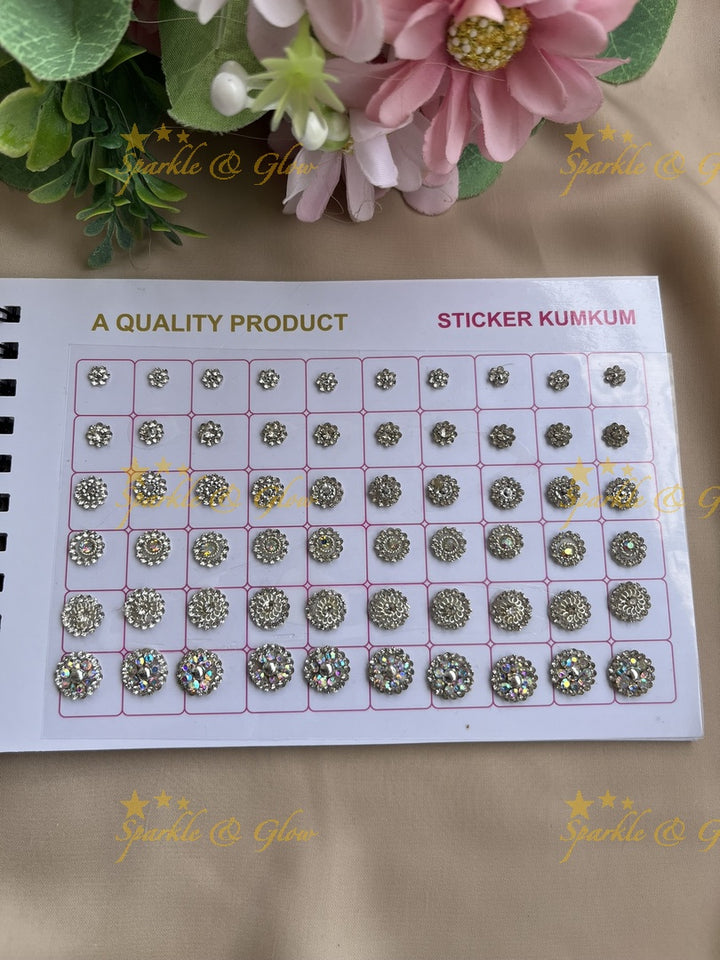 Navya round shape stone silver and gold design bindi with different size in spiral book in assorted colours