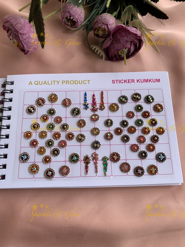 Navya stone silver and gold design bindi with different shape and size in spiral book in assorted colours