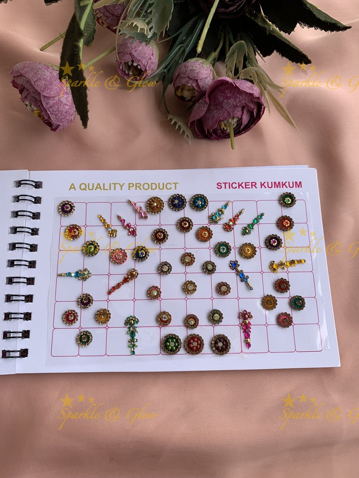 Navya stone silver and gold design bindi with different shape and size in spiral book in assorted colours