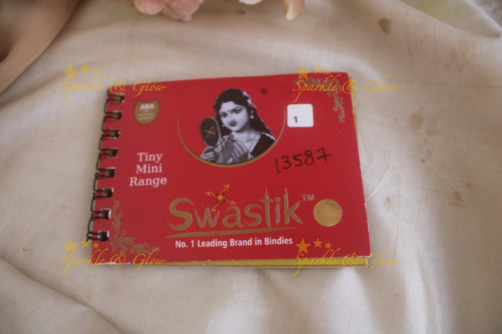Swastik round stone silver and gold design bindi with single size in spiral book in assorted colours