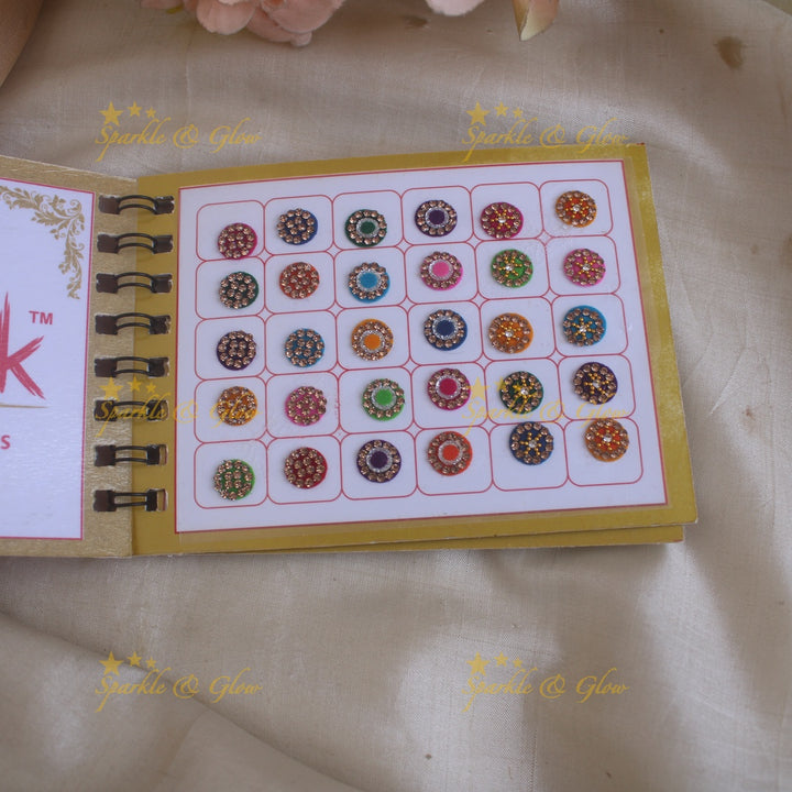 Swastik round stone silver and gold design bindi with single size in spiral book in assorted colours